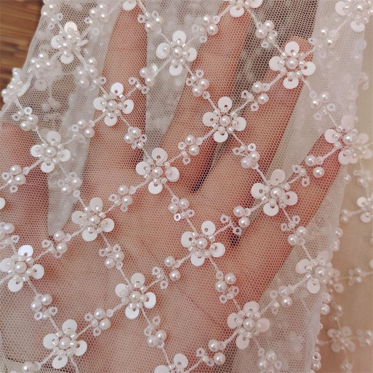 ❤Super gorgeous, exquisite embroidery flowers. Highly recommended to brides! ! ❤ Very delicate and romantic. It can be used for wedding decorations, boho dresses, bridal outfits, tops, clothing fabrics, corsets, curtains, etc... Size Width: 130cm (51 inches) This listing is for 1 yard. Wholesale Available If you need more, please feel free to contact me for a custom list. We usually process your order within 3-5 days, standard shipping will take about 10-15 days, some country may need more time. White Pearl Embroidered Fabric For Mother Of The Bride, Cream Floral Embroidered Fabric For Wedding, Wedding Cream Embroidered Fabric With Floral Applique, Cream Embroidered Fabric With Floral Applique For Wedding, Wedding Tulle Fabric With Floral Embroidery, Bridal White Accessories With Pearl Embroidery, White Tulle Fabric With Floral Embroidery For Wedding, White Embroidered Fabric With Pearl For Wedding, White Embroidered Fabric With Pearl Embroidery For Wedding