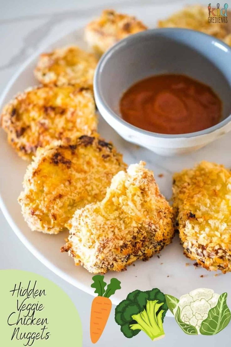 chicken nuggets with dipping sauce on a white plate