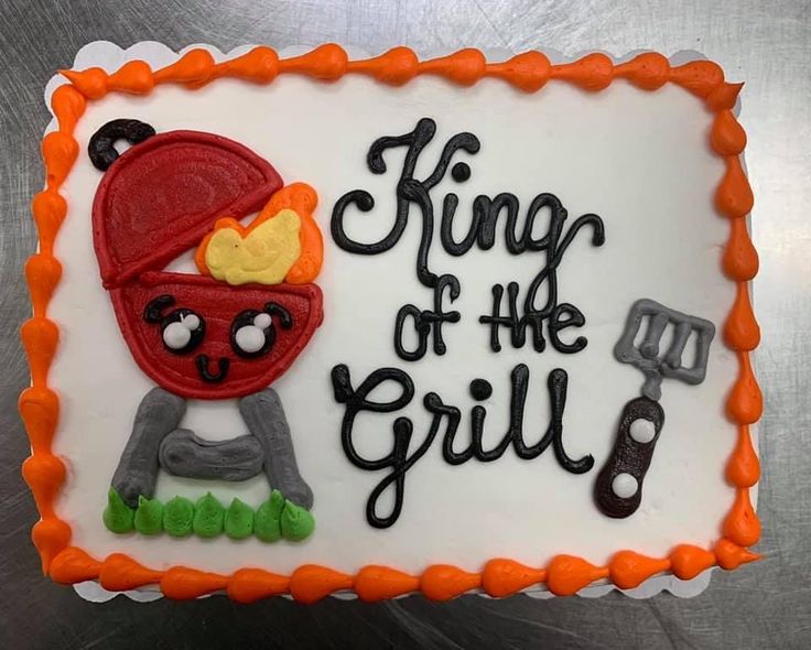 a birthday cake with the words king of the grill on it and an image of a cartoon character