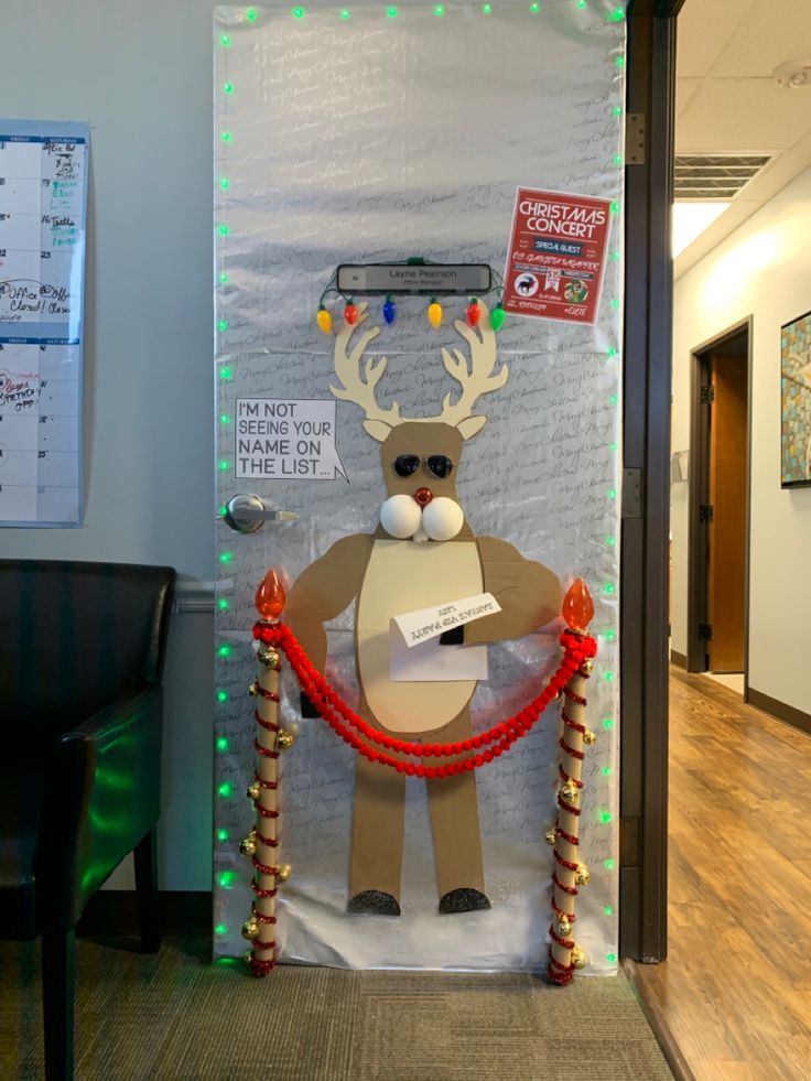 an office decorated for christmas with reindeer decorations