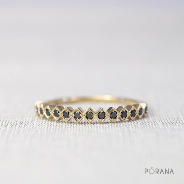 This sophisticated ring from our award winning design collection 'WEAVE', inspired by woven basketry, features a unique pattern of round black diamonds, which can stack with other rings in the collection to create your own woven pattern style. [R0032B] ✦ 14# Black Diamonds, round cut, total carat weight 0.15 (half circle ring) ✦ Natural Black Diamond, AAA quality ✦ Ring width: 2.5mm, height: 1.8mm ✦ Metal available: 14K and 18K solid gold (white gold, rose gold, yellow gold) and Platinum950. Please select from the drop down menu ✦ Ring sizes available 3-8. Please add ring size in Note when order. (other sizes than this please contact me) ⌘ Eternity and ¾ band are also available, please message ring size and metal you want for quotation. ⌘ WEAVE collection receives DEmark (Design Excellence Black Diamond Band Ring, Black Diamond Band, Baguette Diamond Wedding Band, Black Diamond Bands, Graduation Rings, Cute Engagement Rings, Diamond Band Ring, Baguette Diamond Rings, Gold Ring Stack