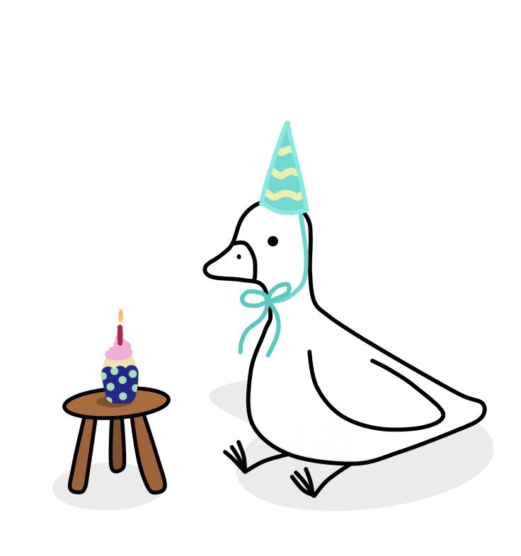 a bird with a birthday hat sitting next to a small table