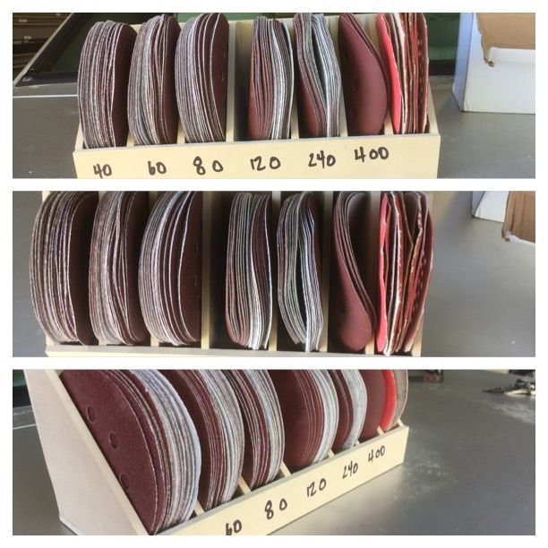 several different types of sanding discs are stacked on a shelf in a storage area