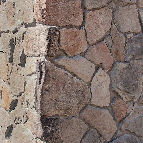 a close up of a stone wall with no mortars or mortars on it