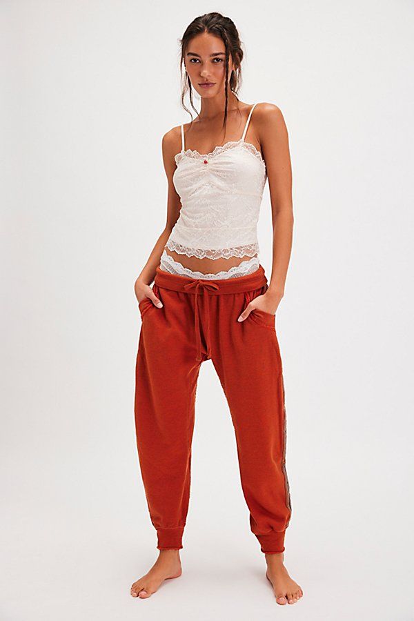 Totally chill in every way, these joggers from Intimately are featured in a harem style with a fold-down waistband and sporty side-stripe detailing. **Fit:** Relaxed, low-rise **Features:** Comfy, terry-lined fabrication, stretchy fold-down waistband, adjustable drawcord, drop-crotch silhouette, cinched cuffs, raw seams, side pockets, side-stripe detail **Why We | Going For It Lounge Joggers by Intimately at Free People in Orange, Size: XS Fitted Sporty Joggers For Lounging, Sporty Fitted Joggers For Lounging, Side Stripe, Small Waist, Boho Outfits, Low Rise, Heather Grey, Cinnamon, Free People