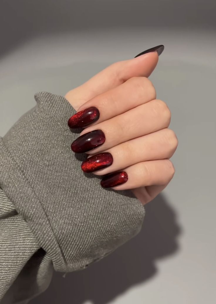 Black And Red Magnetic Nails, Red Cats Eye Nails Design, Black Nails Red Sparkle, Cherry Cola Cat Eye Nails, Black And Red Cats Eye Nails, Red And Black Magnetic Nails, Dark Red Cats Eye Nails, Cat Eye Dark Red Nails, Cat Eye Nails Fall Colors