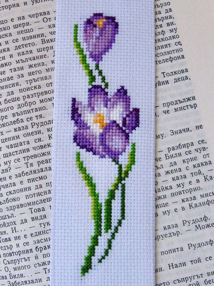 cross stitch bookmark with purple flowers on it