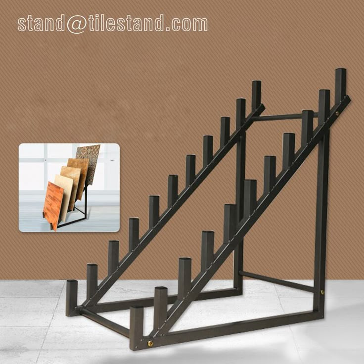 an image of a metal stair case in the shape of a book shelf with books on it