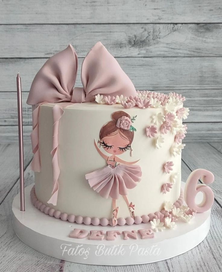 a birthday cake with a ballerina on it