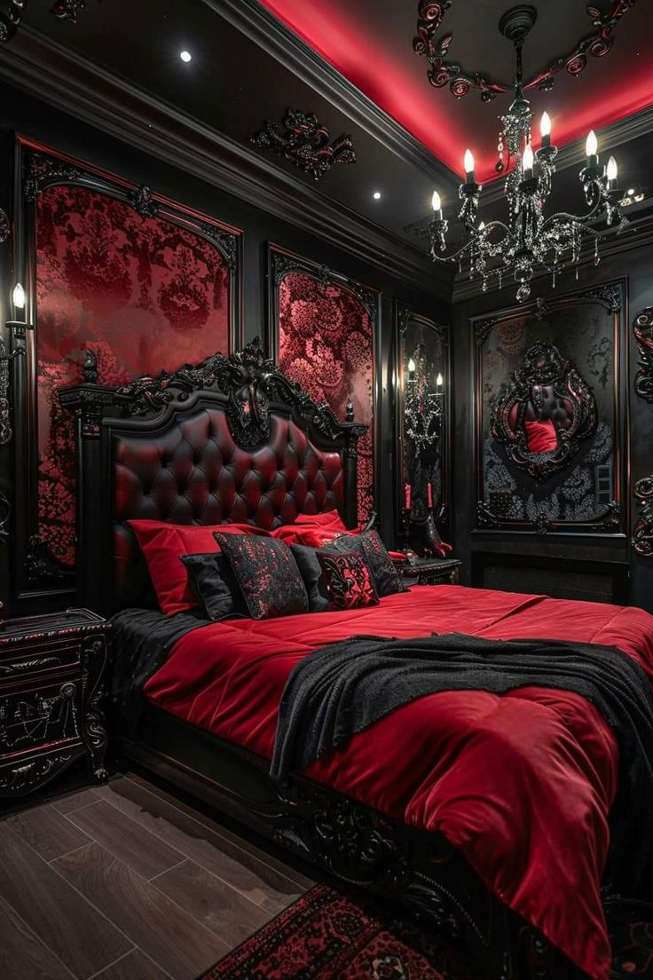 a red and black bedroom with chandelier, bed, rugs and pillows