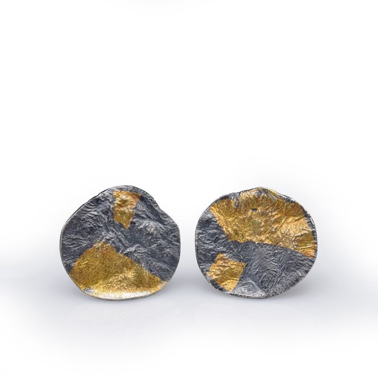 Gold & Silver Earrings - Lightweight and comfortable, the Roccia earrings have sculptural, geologically craggy surfaces and catch the light beautifully.These post earrings are hand fabricated in reticulated sterling silver. The surfaces of the earrings have been fused with a fine 23.5-karat gold sheet, utilizing the Korean keum boo technique. The earrings are oxidized and burnished to bring out the gold and silver hues and the organic forms.The measurement of the large variation of the earri Modern Hand Cast Sterling Silver Earrings, Modern Hand Cast Earrings As A Gift, Contemporary Earrings With Oxidized Finish, Contemporary Oxidized Finish Earrings For Gift, Contemporary Earrings With Oxidized Finish As Gift, Contemporary Oxidized Finish Earrings, Keum Boo Jewelry, Gold Sheets, Keum Boo