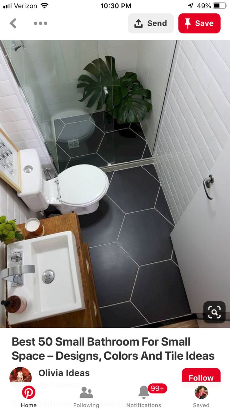 a small bathroom with a toilet, sink and shower stall in black and white tile