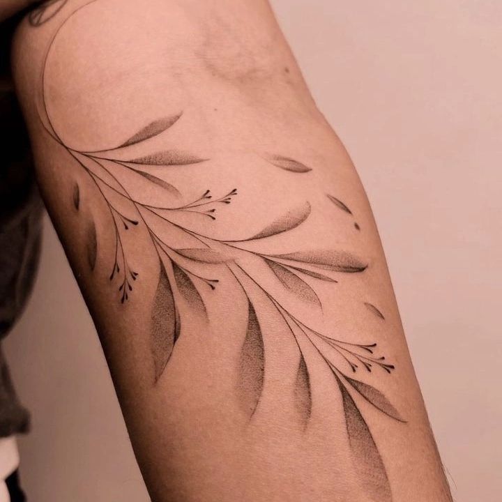 a woman's arm with a tattoo on it