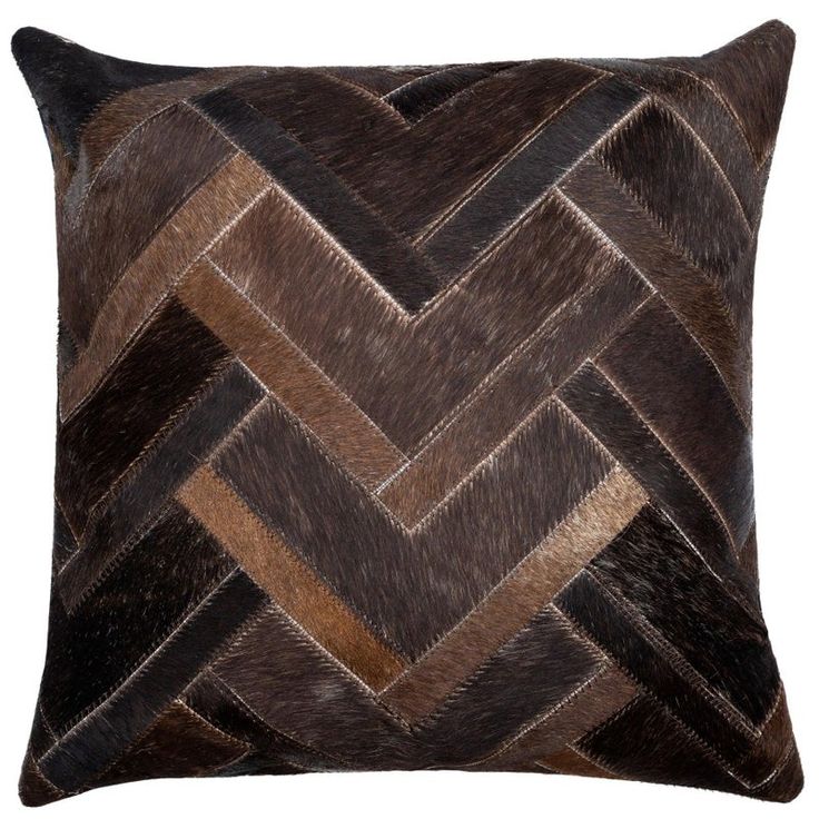 a brown and black pillow on a white background