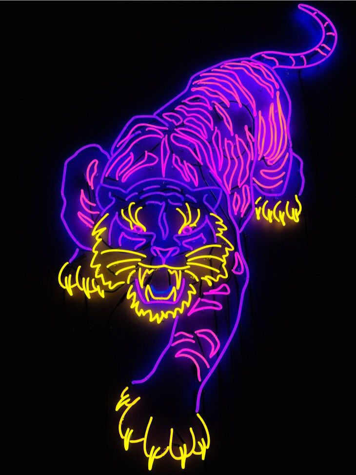 the neon tiger is glowing brightly in the night sky, and it appears to be purple or yellow