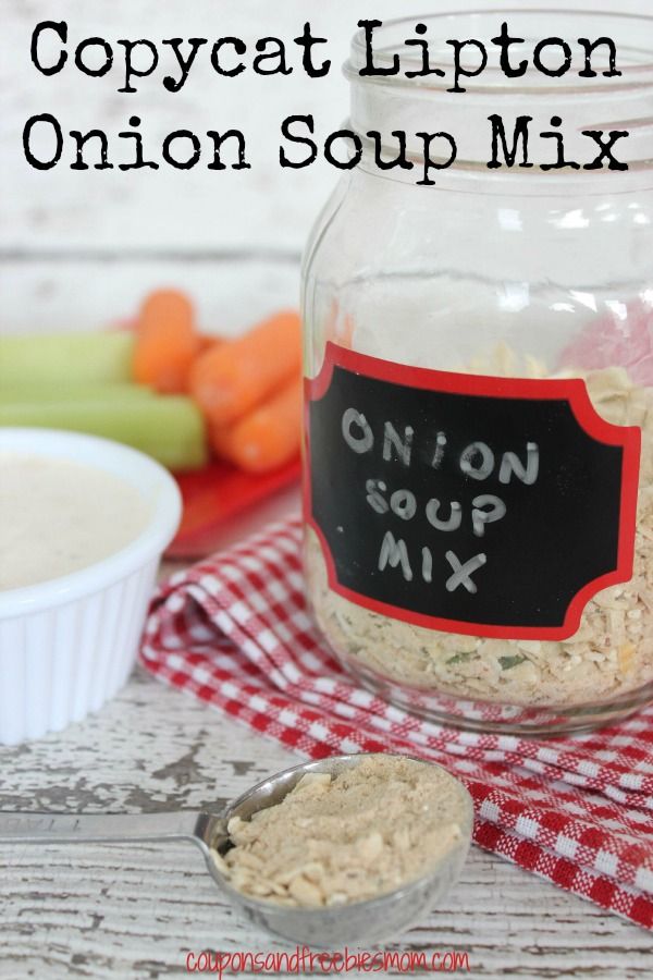 a mason jar filled with onion soup mix next to a bowl of carrots and celery