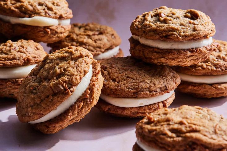 a pile of cookies with cream fillings on top