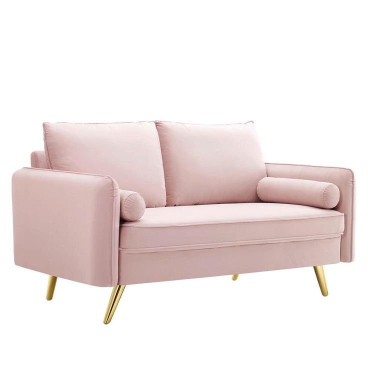 a pink couch with gold legs on a white background