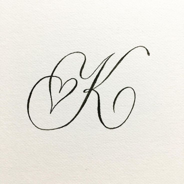 the letter k is made up of cursive writing and black ink on white paper