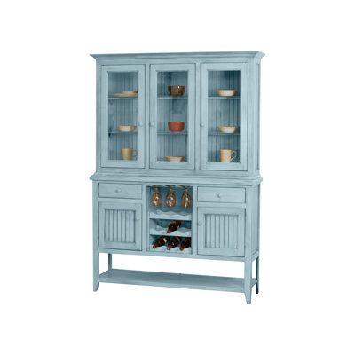 a blue china cabinet with glass doors and shelves