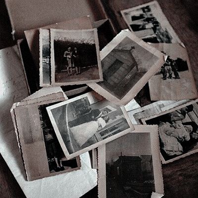 old photos are displayed on top of a table