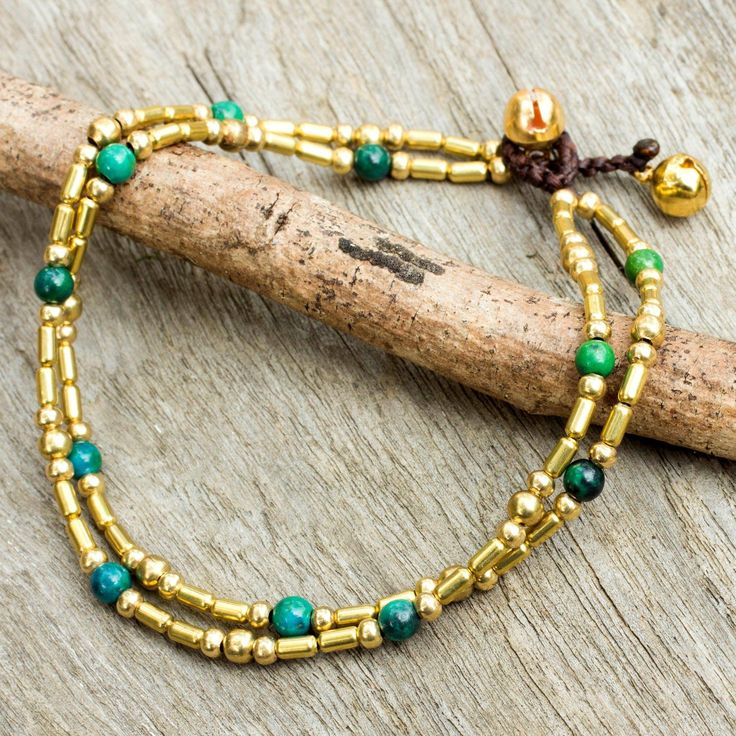 Thailand's Tiraphan Hasub crafts a spectacular anklet of polished brass beads. Enhanced with serpentine globes the anklet fastens with tinkling bells. Anklets Beaded, Beaded Clothing, Jewelry Anklets, Handcrafted Beaded Jewelry, Green Jewelry, Popular Jewelry, Beaded Anklets, Anklet Jewelry, Brass Jewelry