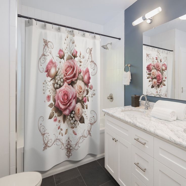 a bathroom with a shower curtain decorated with pink roses and white peonies on it