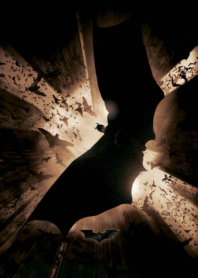 the dark knight rises from the shadows in batman's bat - wing costume, as seen from above