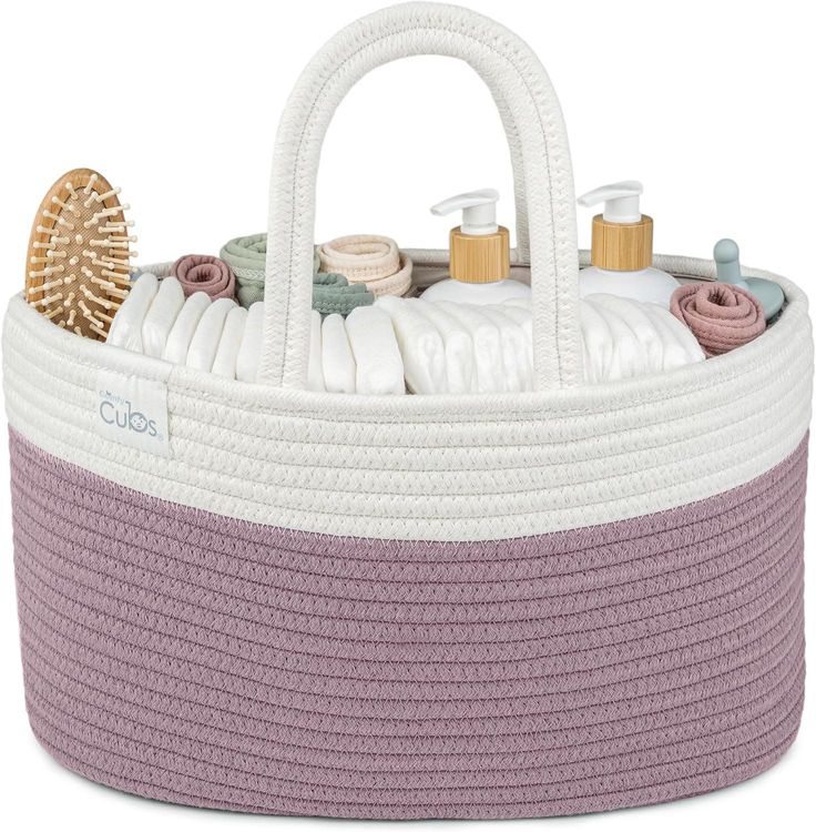 a white and purple basket filled with personal care items on top of a white surface