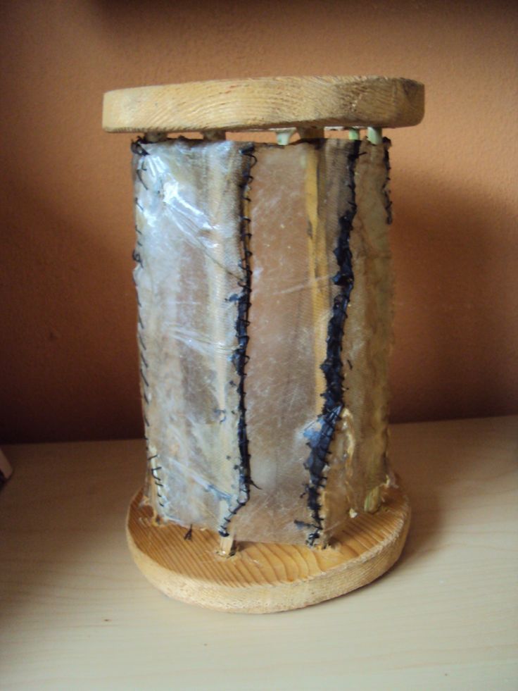 a wooden stand holding a large piece of cake