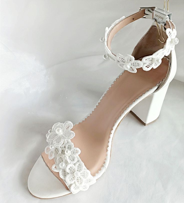 Pearl Lace Block Heel Wedding Shoes for Bride  Step into a world of romance and sophistication with our exquisite Wedding Shoes featuring delicate white flowers with pearls, carefully handcrafted to elevate your bridal ensemble with timeless elegance. The luxurious leather lining is cushioned in all the right places to ensure ultimate comfort. Handmade with the utmost care and attention to detail. Indulge in luxurious comfort as you walk down the aisle in style. *White or Ivory cow leather *Bloc Block Heel Wedding Shoes, Pearl Lace, Wedding Shoes Lace, Wedding Shoes Heels, Pearl And Lace, Pearl Bridal, Womens Wedding Shoes, Wedding Heels, Bride Shoes