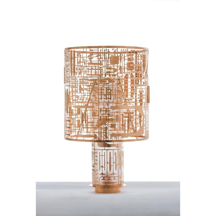 a lamp that is made out of wire and has an intricate design on the top