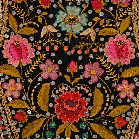 an embroidered cloth with flowers on it