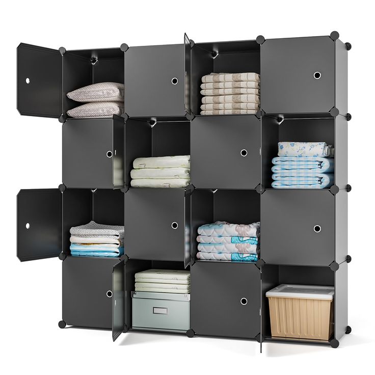 an organized shelving unit with folded towels