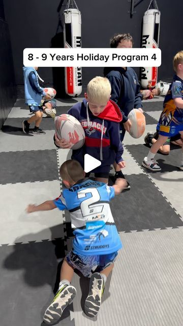 several children playing with balls in a gym