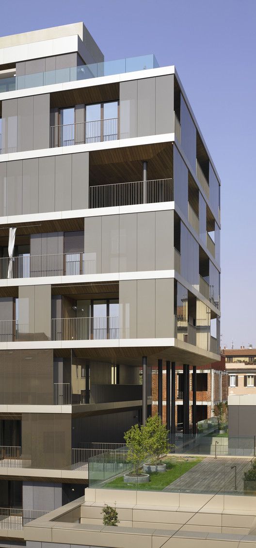 an apartment building with balconies and balconies on the second floor is shown