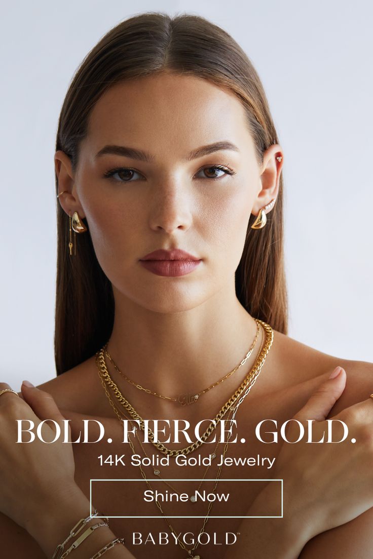 a woman wearing gold jewelry with the words bold fierce, gold