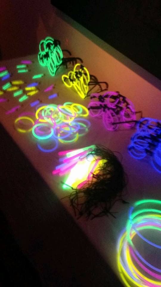 several different colored lights on a table with circles and rings in the middle, all lit up