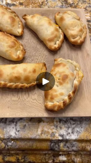 some food is laying on a cutting board and ready to be cooked in the oven