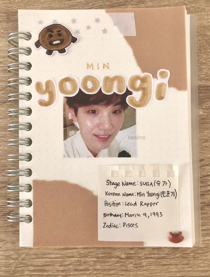 a notebook with an image of a young person on it and the words'min yong'written in japanese