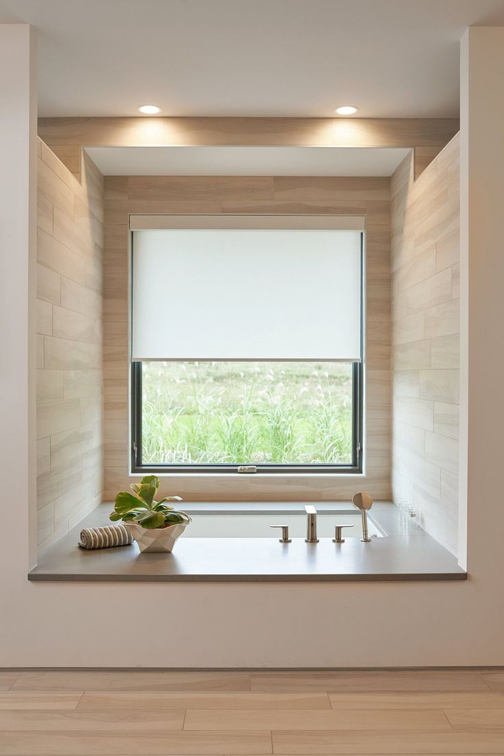 a kitchen with a sink and window in it