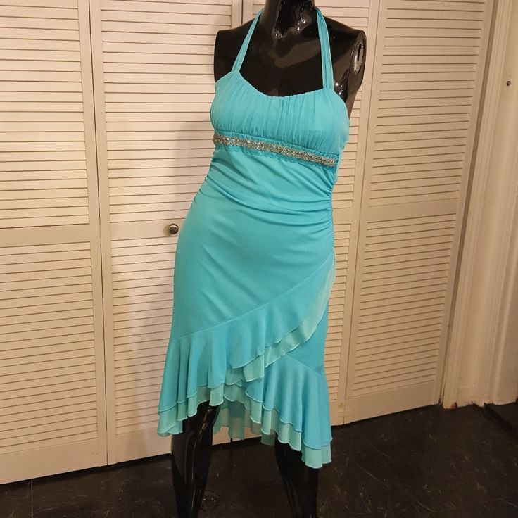 Comfortable Cocktail Dress With Stretchy Fabric. Beautiful Teal Blue Color. Never Worn. Ruffles On Bottom. Junior Size Large. 31 Inches From Waist To Bottom On Longest Part Of Dress. 15 In Around Front Waist And 20 In Around Front Chest. I'm A Fast Shipping Seller - I Accept Reasonable Offers. Send One My Way - You Rock! Thanks For Stopping By Teal Birthday Dress, Teal Fringe Dress, Sparkly Teal Dresses, Y2k Blue Mini Length Dress, 2000s Blue Dress, Long Teal Dress, 2000s Dresses, 2000s Dress, Midwest Princess