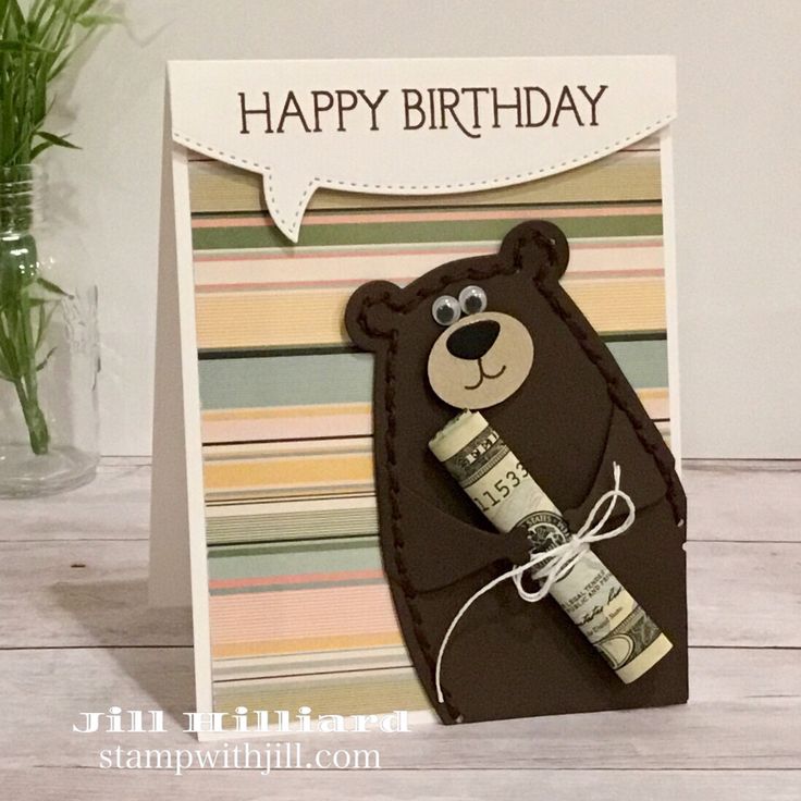 a birthday card with a bear holding a cork