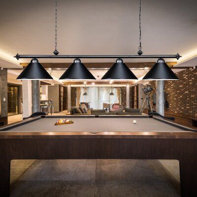 a pool table with three lamps hanging over it