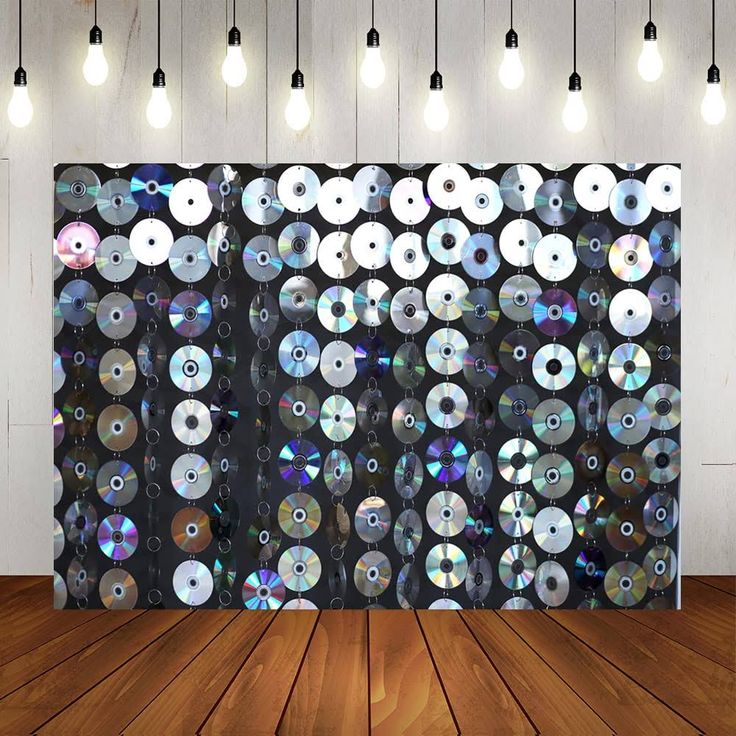 an image of a wall with many cds on it