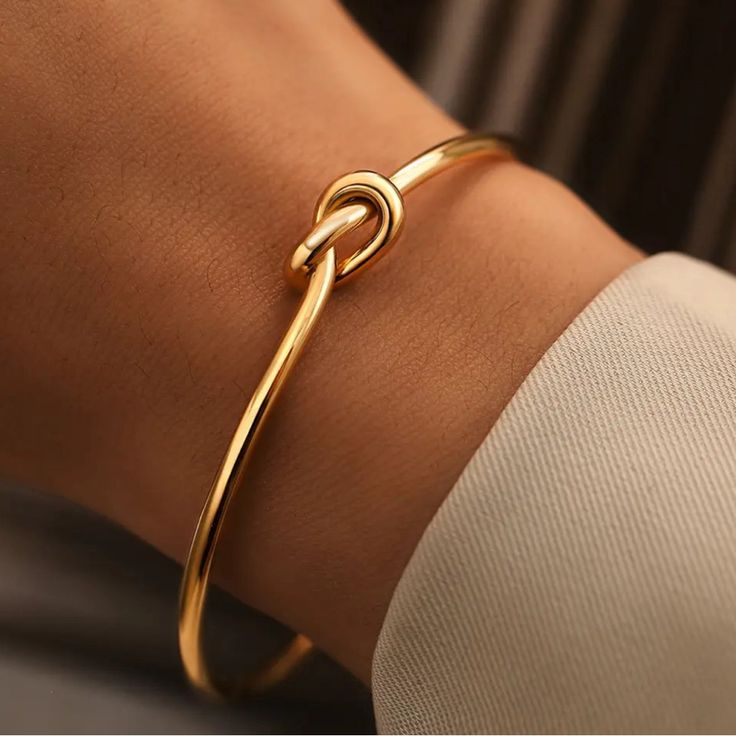 Adjustable Gold Knot Cuff Bracelet Is A Staple In Your Everyday Stack. Featuring A Sleek, Minimalist Design With A Distinctive Knot Centerpiece, This Bracelet Blends Timeless Elegance With Modern Simplicity. Made To Be Shaped To Your Wrist, And A Perfect Add To Your Stack. Key Features: - Material:Gold-Tone Alloy - Open Cuff Design For Easy Wear And Adjustable Fit - Daily Wear, From Casual To Formal - Adding A Refined Touch To Your Office Attire - Special Occasions Like Weddings Or Anniversaries Adjustable Bangle For Everyday, Adjustable Dainty Bangle, Twist Bracelet, Knot Bangle, Twisted Bangle, Infinity Knot, Bangles For Women, Twisted Bracelet, The Bangles