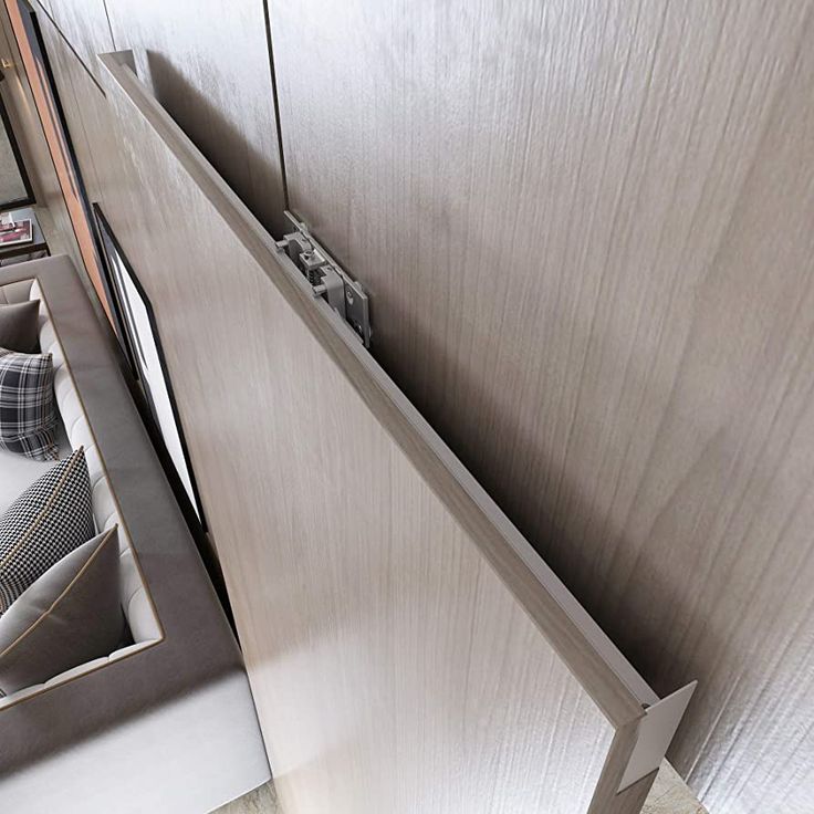 a kitchen with stainless steel appliances and wood cabinets in the back ground, looking down at it