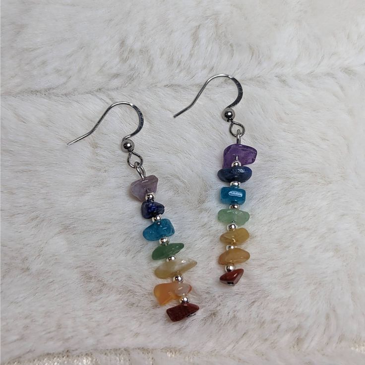 Chakra Crystal Beaded Charm Stainless Steel Earrings. Comes On Stainless Steel Fish Hook Earrings. Chip Bead Size And Color Will Vary As These Are Made To Order. Made With Amethyst, Dyed Quartzite, Aventurine, Quartz And Coral Chip Stones. Seed Bead And Wire Jewelry, Quartz Earrings Diy, Rock Bead Earrings, Bead Work Earrings, Crystal Bead Earrings Diy, Handmade Earrings With Beads, Crystal Chip Earrings, Silver Beaded Earrings With Natural Stones, Mushroom Bead Earrings