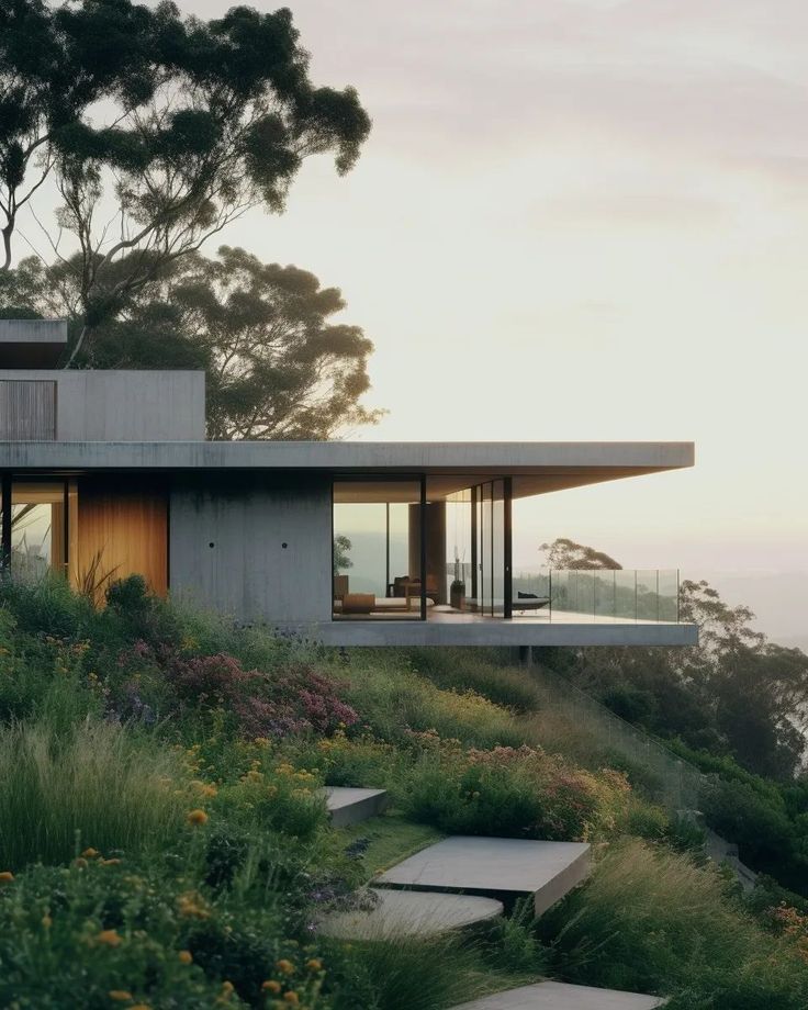 a house on top of a hill overlooking the ocean