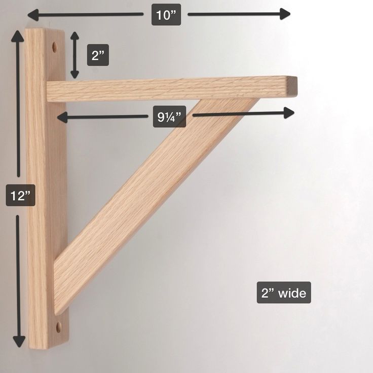 a wooden shelf with measurements for the top and bottom